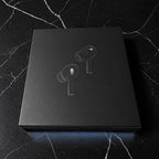 AirPods Pro 2 black earbuds box on marble surface