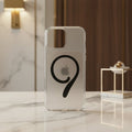 iPhone 14 Pro Max clear magnetic case on phone showing magnetic ring - marble and wood background