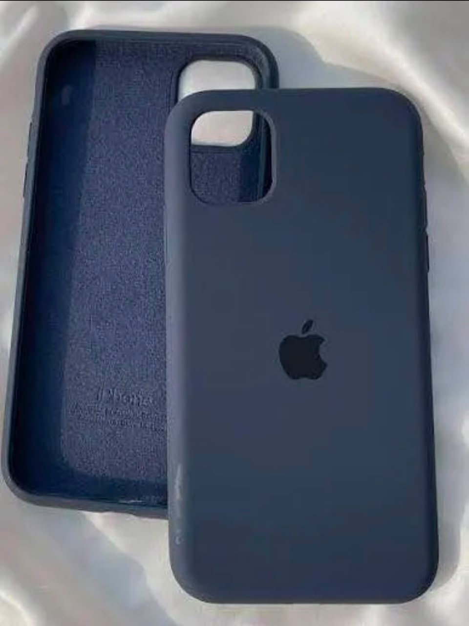 iPhone 12 Pro midnight blue Apple silicone case front and back on white satin fabric