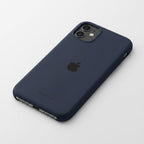 iPhone 11 orange silicone case front and back on dark reflective surface - product shot