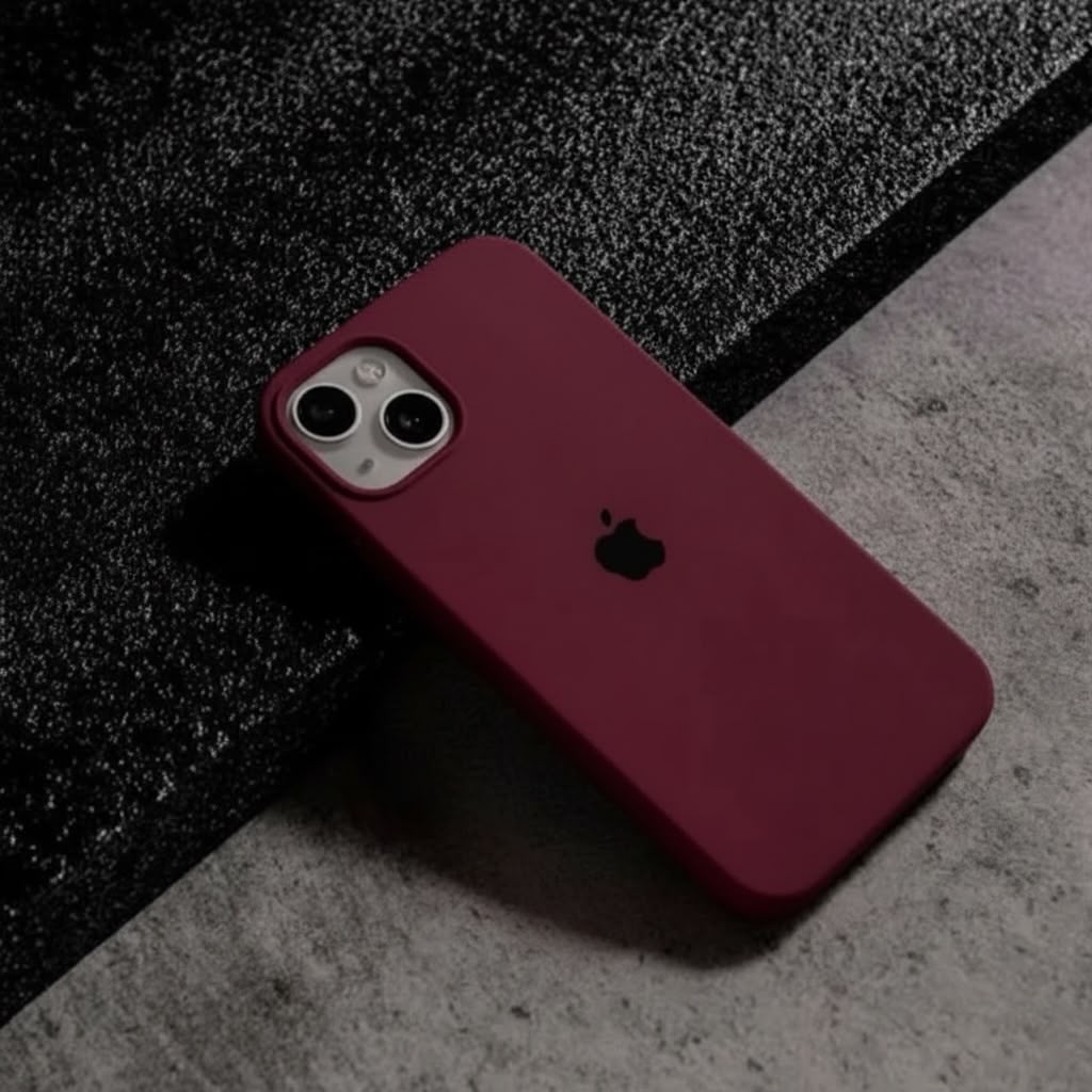 iPhone 14 grey silicone case on phone flat lay on white surface - top view showing triple camera cutout